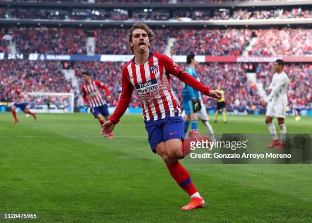 Antoine Griezmann of Atletico Madrid celebrates after scoring his team's first goal during the La Liga match between Club Atletico de Madrid and Real...