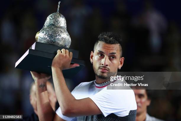 Nick Kyrgios of Australia celebrates with the champion trophy during the final match between Nick Kyrgios of Australia and Alexander Zverev of...