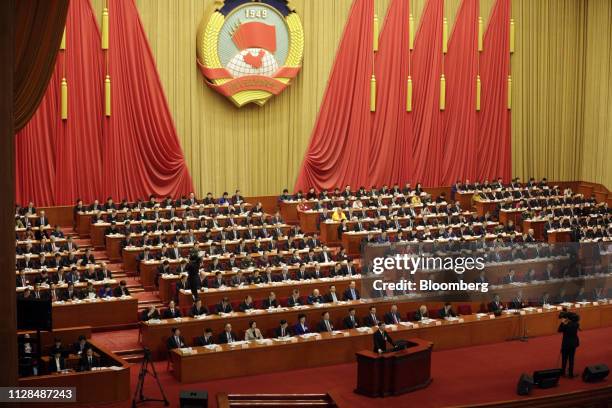 Wang Yang, chairman of the Chinese People's Political Consultative Conference , bottom center, delivers a work report during the opening of the...