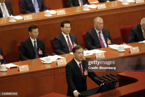 Wang Yang, chairman of the Chinese People's Political Consultative Conference , front center, delivers a work report during the opening of the second...