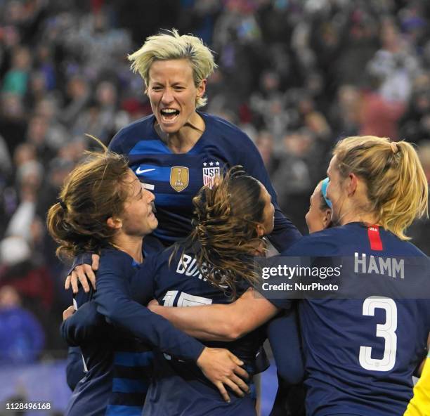 Team celebration after Tobin Heath of The United States scores the goal to tie the game during the SheBelieves Cup match between The United States...