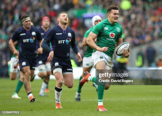 Jacob Stockdale of Ireland breaks clear to score their second try during the Guinness Six Nations match between Scotland and Ireland at Murrayfield...