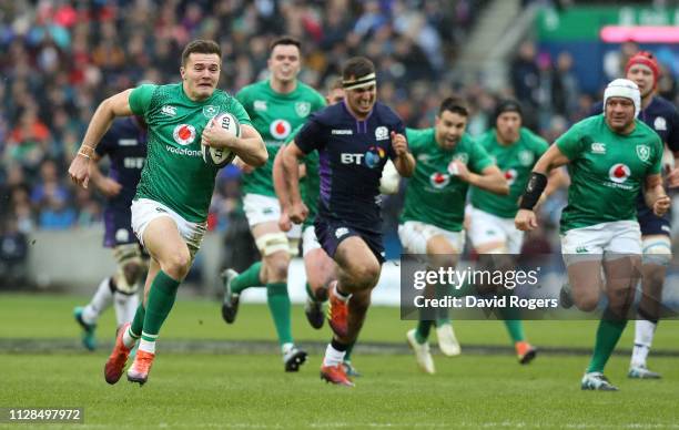 Jacob Stockdale of Ireland breaks clear to score their second try during the Guinness Six Nations match between Scotland and Ireland at Murrayfield...