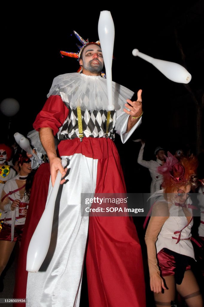 A participants seen dressed up in a colourful costume...