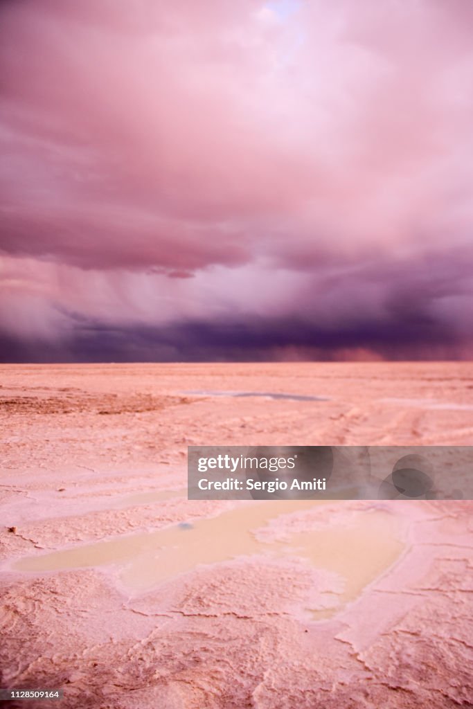 Sunset dramatic cloudy sky at Uyuni Salt Flats