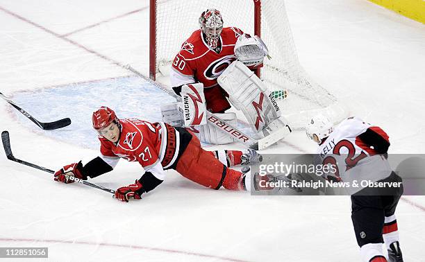 The Ottawa Senators' Chris Kelly fires a shot past the Carolina Hurricanes' Brett Carson and goalie Cam Ward for the Senators only goal of the game....