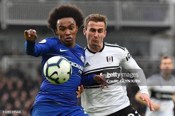 Chelsea's Brazilian midfielder Willian vies with Fulham's English defender Joe Bryan during the English Premier League football match between Fulham...