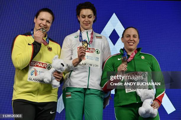 Silver medallist Germany's Christina Schwanitz , gold medallist Bulgaria's Radoslava Mavrodieva and bronze medallist Hungary's Anita Marton pose with...