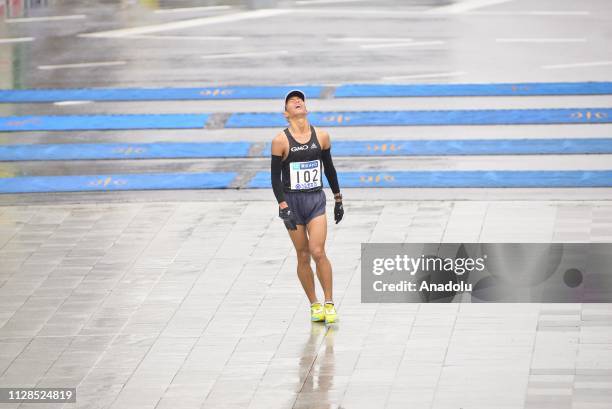 Runner exhausted with fatigue is staggering arriving at the finish line of the Tokyo Marathon 2019 in Tokyo, Japan on March 3, 2019.