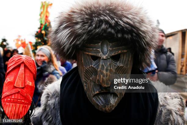 Performers in scary masks entertain the public during the Maslenitsa festival [Pancake Week] that celebrates the end of winter and marks the arrival...