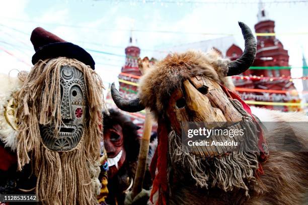 Performers in scary masks entertain the public during the Maslenitsa festival [Pancake Week] that celebrates the end of winter and marks the arrival...