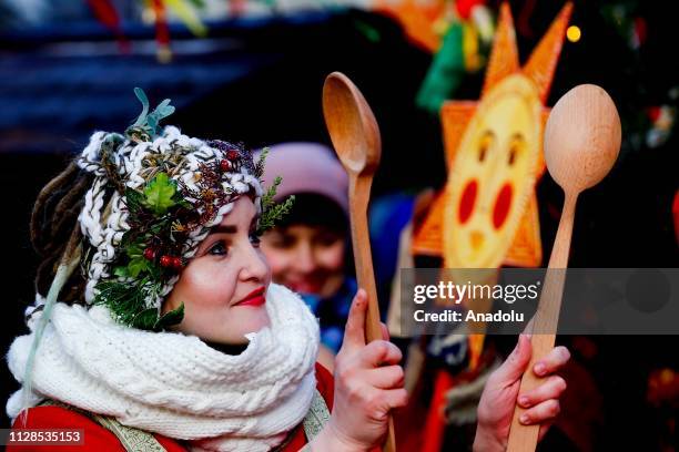 Performers dressed in traditional costumes attend the Maslenitsa festival [Pancake Week] that celebrates the end of winter and marks the arrival of...