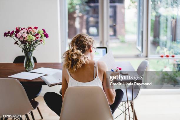 young woman studying - white flower paper stock pictures, royalty-free photos & images
