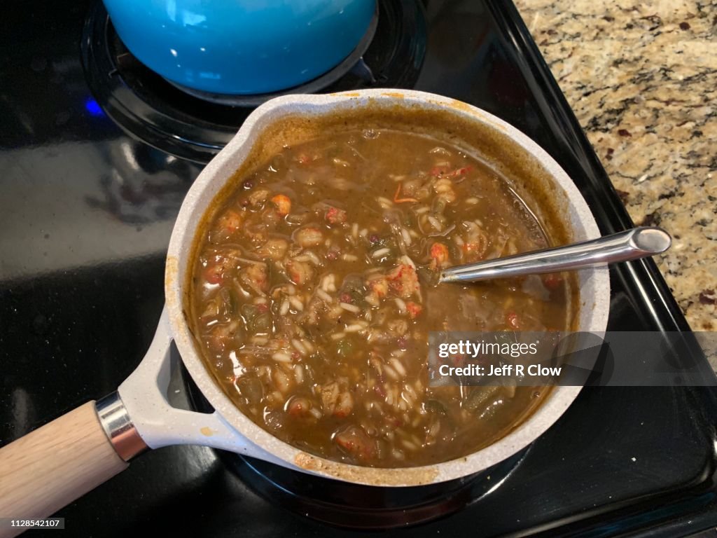 Homemade southern gumbo cooking on the stovetop