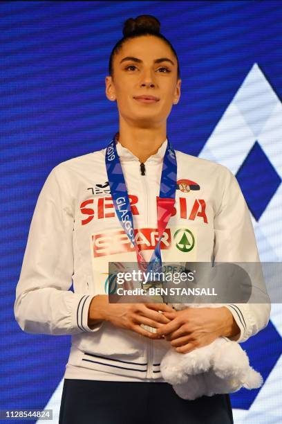 Gold medallist Serbia's Ivana Spanovic poses on the podium after the womens long jump final at the 2019 European Athletics Indoor Championships in...
