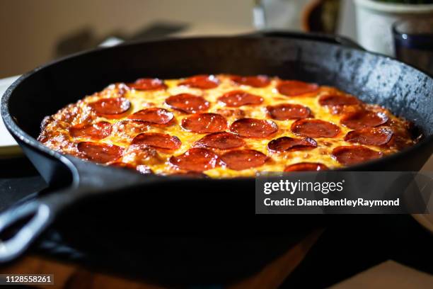 cast iron deep dish pepperoni pizza - skillet stock pictures, royalty-free photos & images