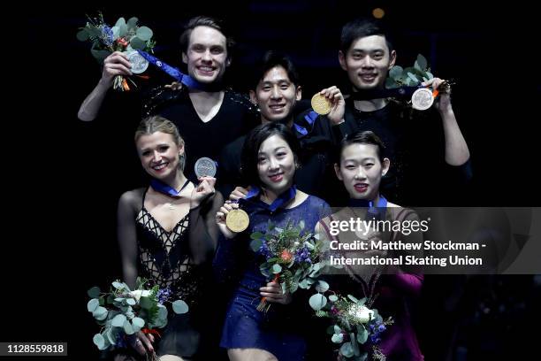 Silver medalists Kirsten Moore-Towers and Michael Marinaro of Canada, gold medalists Wenjing Sui and Cong Han of China, Cheng Peng and bronze...