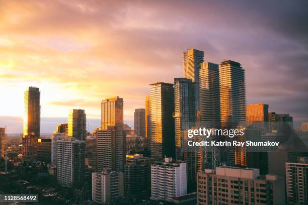 sunset coloured modern city - toronto stockfoto's en -beelden