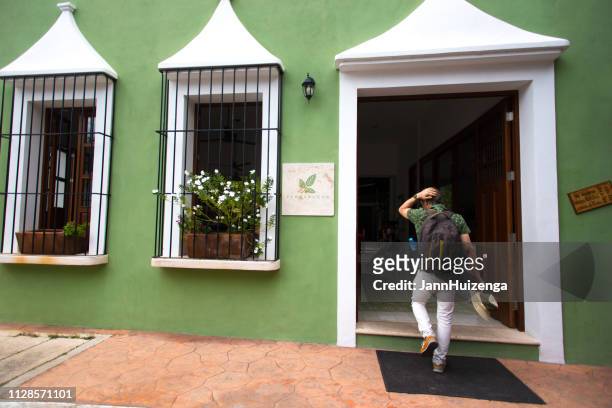 valladolid, yucatan, mexico: tourist enters - entering restaurant stock pictures, royalty-free photos & images