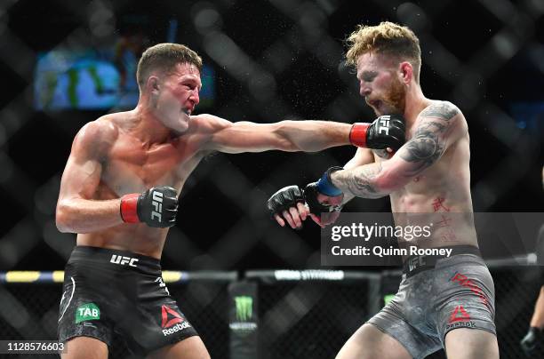 Shane Young lands a punch in his fight against Austin Arnett in their Featherweight fight during UFC234 at Rod Laver Arena on February 10, 2019 in...