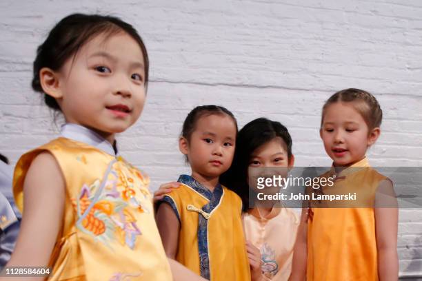 Models prepare backstage for Amelie Wang during New York Fashion Week: The Shows at Industria Studios on February 09, 2019 in New York City.