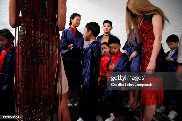 Models prepare backstage for Amelie Wang during New York Fashion Week: The Shows at Industria Studios on February 09, 2019 in New York City.
