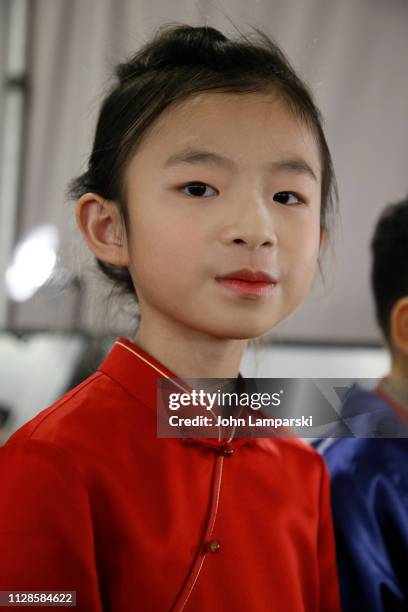 Model prepares backstage for Amelie Wang during New York Fashion Week: The Shows at Industria Studios on February 09, 2019 in New York City.