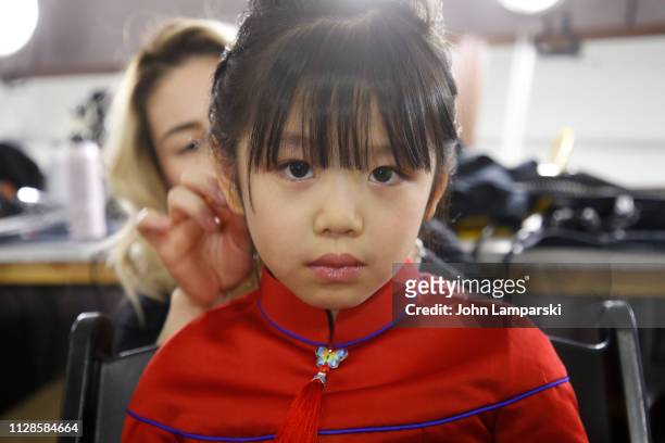 Model prepares backstage for Amelie Wang during New York Fashion Week: The Shows at Industria Studios on February 09, 2019 in New York City.