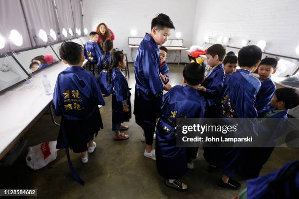 Models prepare backstage for Amelie Wang during New York Fashion Week: The Shows at Industria Studios on February 09, 2019 in New York City.