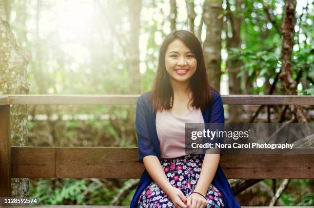 portrait of happy young asian woman - kadazandusun stock pictures, royalty-free photos & images