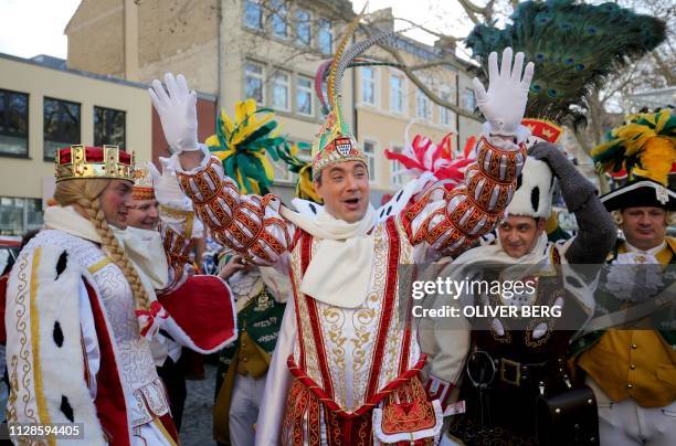 Members of the "Dreigestirn" triumvirate Jungfrau Catharina , Prince Marc I and Bauer Markus prepare to attend the Rose Monday carnival street parade...