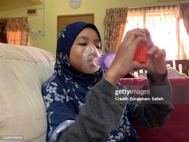 daily asthma care - asthma inhaler child stock pictures, royalty-free photos & images