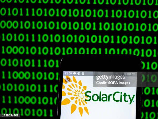In this photo illustration, the SolarCity energy company logo seen displayed on a smartphone.