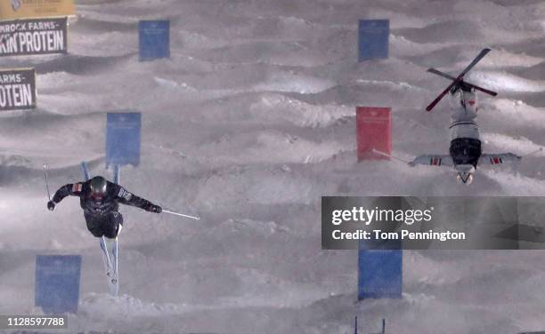 Bradley Wilson of the United States competes against Mikael Kingsbury of Canada in the Big Final of the Men's Dual Moguls Final of the FIS Freestyle...