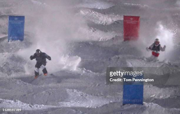 Bradley Wilson of the United States competes against Mikael Kingsbury of Canada in the Big Final of the Men's Dual Moguls Final of the FIS Freestyle...