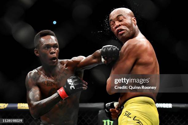 Israel Adesanya of Nigeria punches Anderson Silva of Brazil during their Middleweight bout during UFC234 at Rod Laver Arena on February 10, 2019 in...