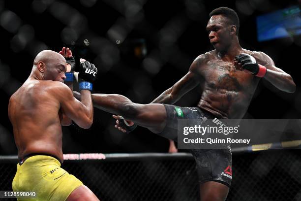 Israel Adesanya of Nigeria kicks Anderson Silva of Brazil during their Middleweight bout during UFC234 at Rod Laver Arena on February 10, 2019 in...