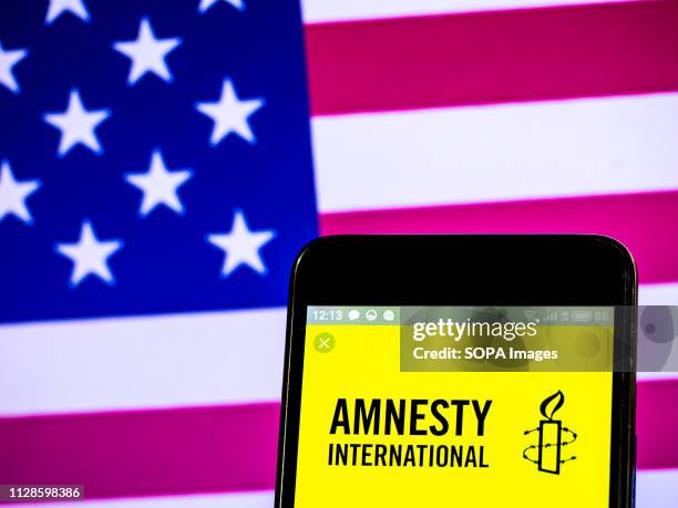 In this photo illustration, the Amnesty International non-governmental organization logo seen displayed on a smartphone.