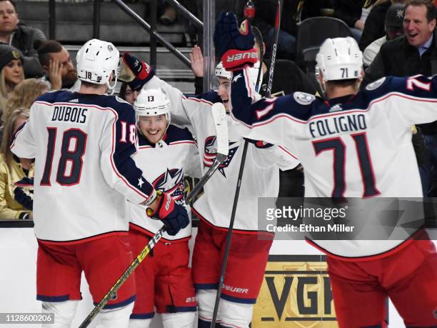 Pierre-Luc Dubois, Cam Atkinson, Zach Werenski and Nick Foligno of the Columbus Blue Jackets celebrate after Werenski assisted Atkinson on his second...