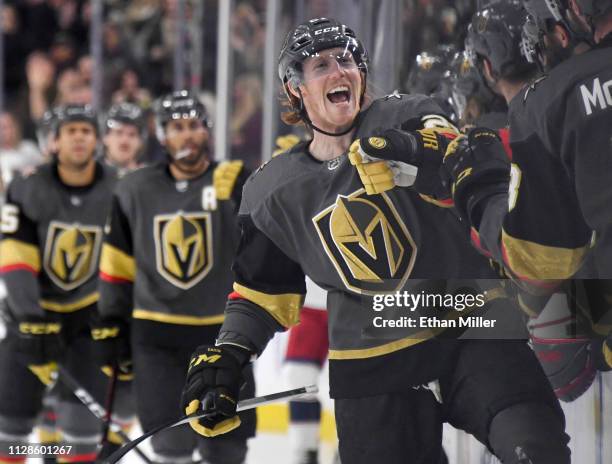 Cody Eakin of the Vegas Golden Knights celebrates with teammates on the bench after scoring a third-period goal against the Columbus Blue Jackets...