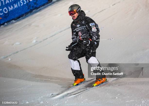 Bradley Wilson of the United States reacts after crossing the finish line during the final on his way to finishing in second place in the Men's Dual...