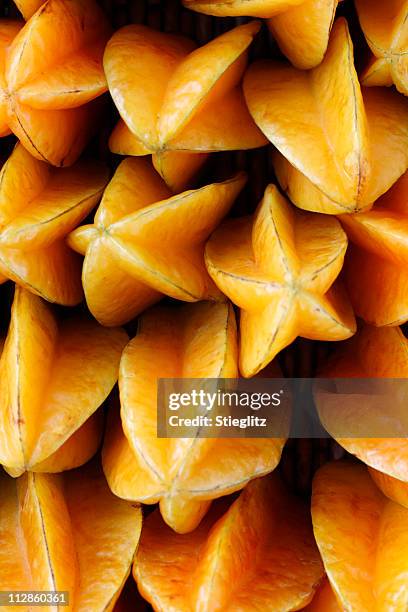 photograph of multiple starfruit - carambola stock pictures, royalty-free photos & images