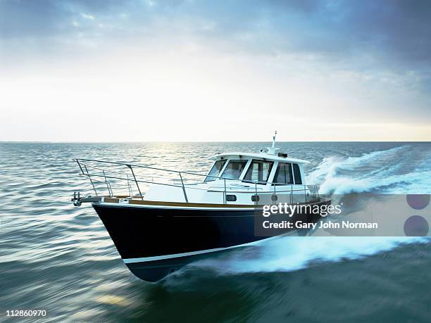 motor boat powering through the sea - motorboot stock-fotos und bilder