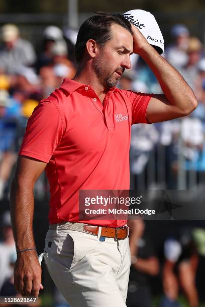 Wade Ormsby of Australia look dejected after missing a putt on the 18th green in order to tie the event during Day four of the ISPS Handa Vic Open at...