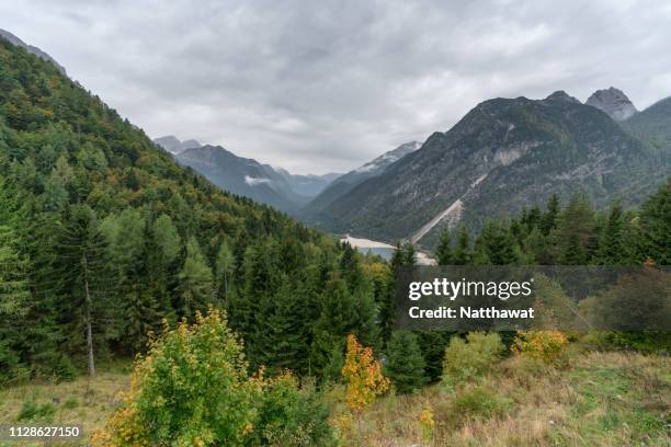 a valley view from a mountain top in slovenia - julianische alpen stock-fotos und bilder