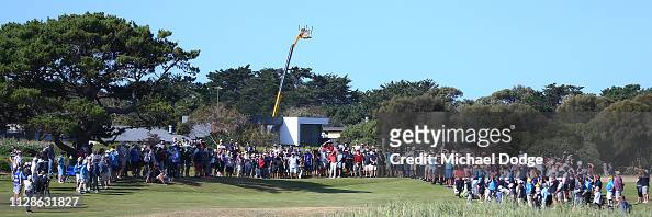Wade Ormsby of Australia hits an approach shot to the 18th green as ...