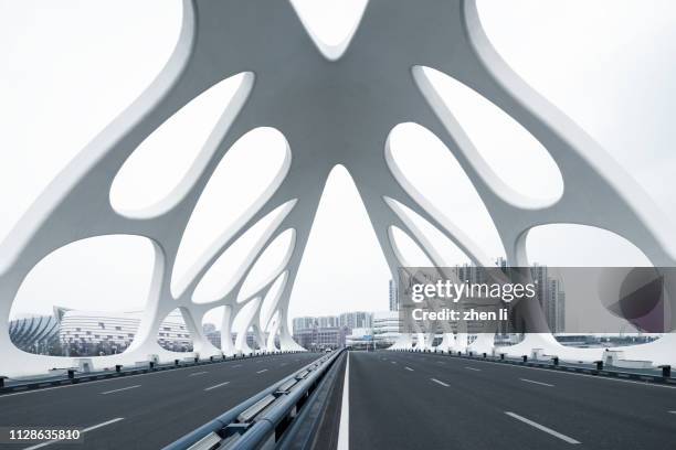 moern bridge with strange structures, qingdao - qingdao bridge stock pictures, royalty-free photos & images