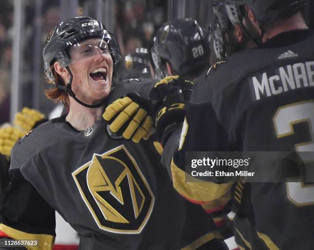 Cody Eakin of the Vegas Golden Knights celebrates with teammates on the bench after scoring a third-period goal against the Columbus Blue Jackets...