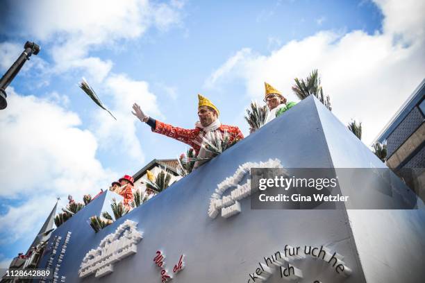 Carnival members throw sweets during Rose Monday Carnival parade on March 4, 2019 in Cologne, Germany. Cities throughout the Rhineland region are...