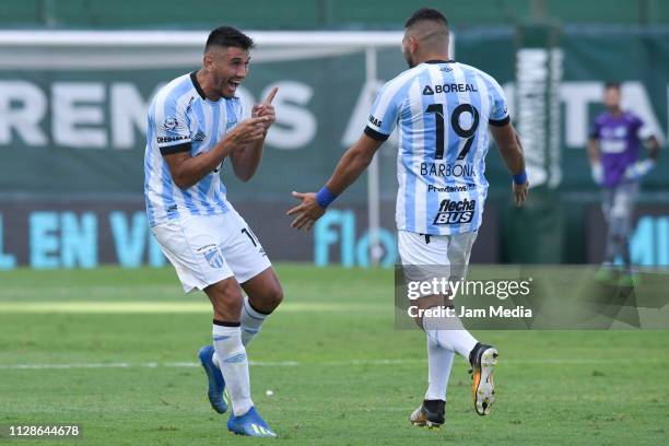 Gervasio Nuñez of Atletico Tucuman celebrates with teammate David Barbona after scoring his side's second goal during a match between Banfield and...